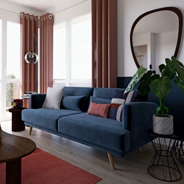 Canapé Elvis de Maisons du Monde en velours bleu dans beau salon lumineux
